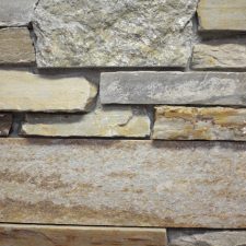 A colored stone veneer with varying stone alignments.