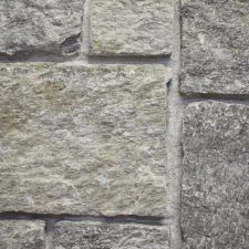 Smooth stone veneers with defined mortar lines.