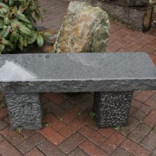 Rough cut dark granite bench
