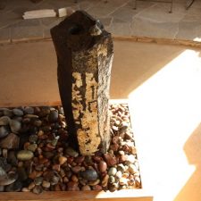 A singular stone pillar.