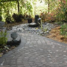 A stone pathway with a large circular focal point.