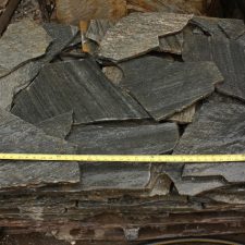 Wet charcoal colored flagstone pieces